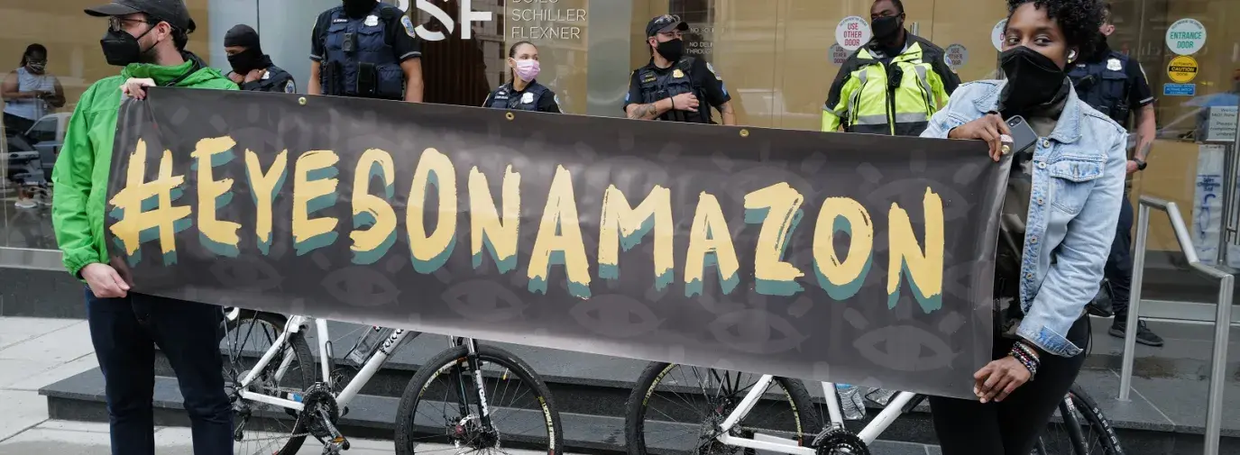 Protesters gather outside investors’ offices in Washington, DC, ahead of Amazon’s shareholder meeting in 2021. Photo by Phil Pasquini.